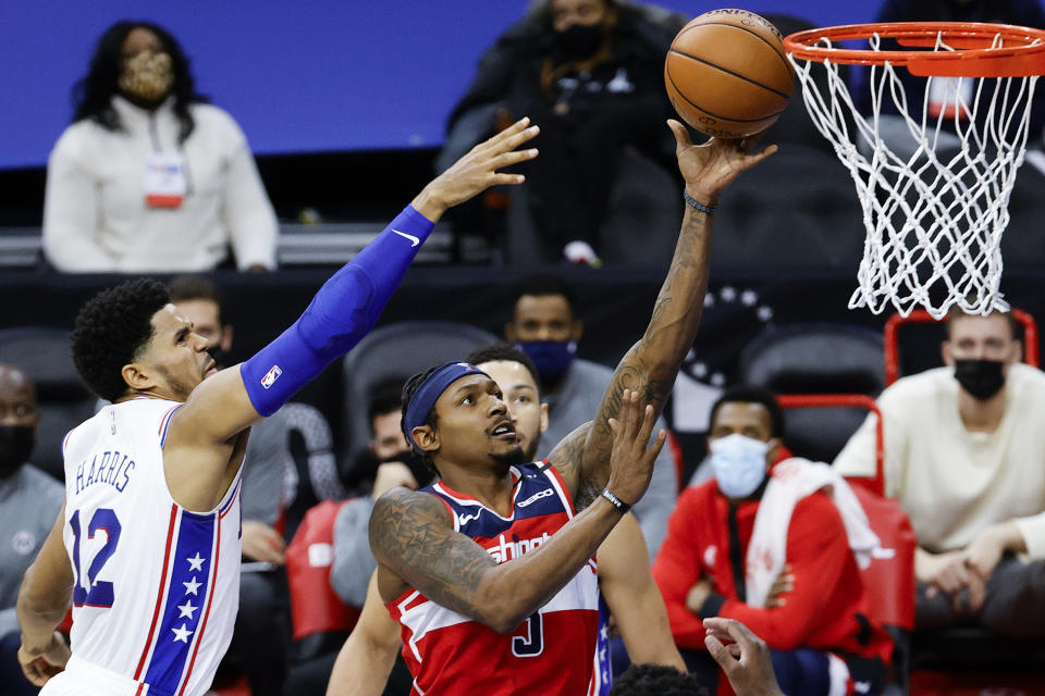 PHILADELPHIA, PENNSYLVANIA - JANUARY 06: Bradley Beal #3 of the Washington Wizards shoots a lay up past Tobias Harris #12 of the Philadelphia 76ers during the second quarter at Wells Fargo Center on January 06, 2021 in Philadelphia, Pennsylvania. NOTE TO USER: User expressly acknowledges and agrees that, by downloading and or using this photograph, User is consenting to the terms and conditions of the Getty Images License Agreement. (Photo by Tim Nwachukwu/Getty Images)