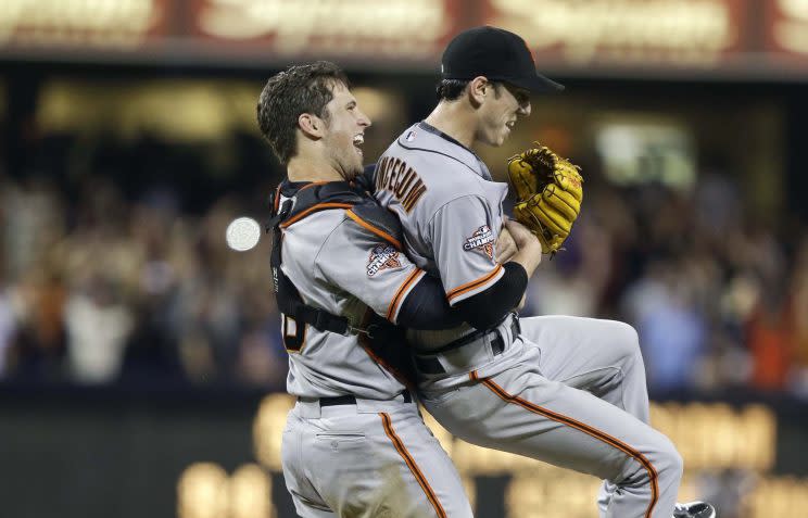 San Francisco Giants starting pitcher Tim Lincecum gets lifted by catcher Buster Posey after his no hit game against the San Diego Padres in a baseball game in San Diego, Saturday, July 13, 2013. The Giants won the game 9-0. Tim Lincecum has thrown his first career no-hitter and the second in the majors in 11 days, a gem saved by a spectacular diving catch by right fielder Hunter Pence in the San Francisco Giants' 9-0 win against the last-place San Diego Padres on Saturday night. (AP Photo/Lenny Ignelzi)