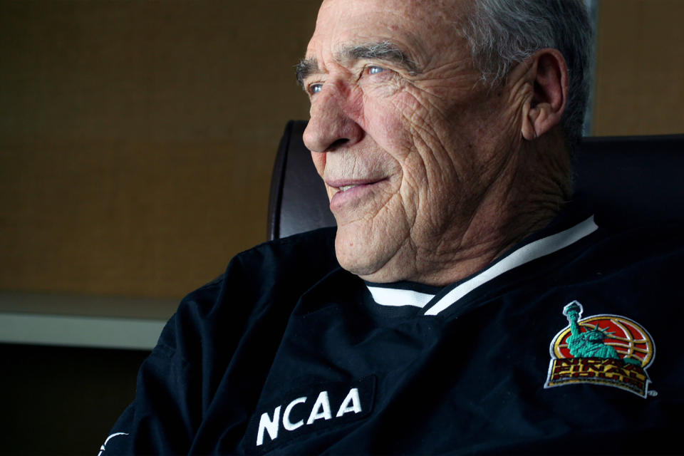 FILE - Jim Phelan, head coach of the Mount St. Mary's men's NCAA college basketball team, ponders his future in his office, in this Wednesday, Feb. 26, 2003, file photo. Phelan, who won 830 games during nearly a half-century at Mount St. Mary's, has died. He was 92. The athletic department at Mount St. Mary's said Phelan died in his sleep at home Tuesday night, June 15, 2021. (AP Photo/Timothy Jacobsen, File)