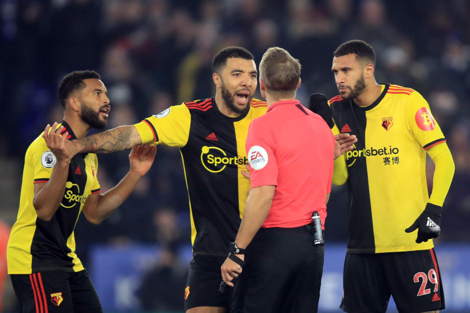 LEICESTER, ENGLAND - DECEMBER 04: Watford player led by Troy Deeney argue with  referee Craig Pawson over the penalty decision during the Premier League match between Leicester City and Watford FC at The King Power Stadium on December 4, 2019 in Leicester, United Kingdom. (Photo by Marc Atkins/Getty Images)