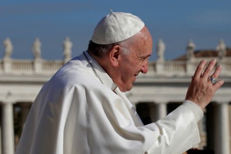 Pope Francis waves at the end of the Wednesday general audience in Saint Peter's square at the Vatican November 22, 2017. REUTERS/Max Rossi