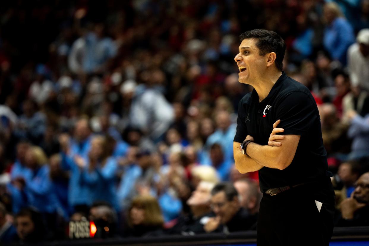 Cincinnati Bearcats head coach Wes Miller communicates with his team in the second half of the NCAA men's basketball game between the Dayton Flyers and Cincinnati Bearcats at Heritage Bank Center in Cincinnati on Saturday, Dec. 16, 2023.