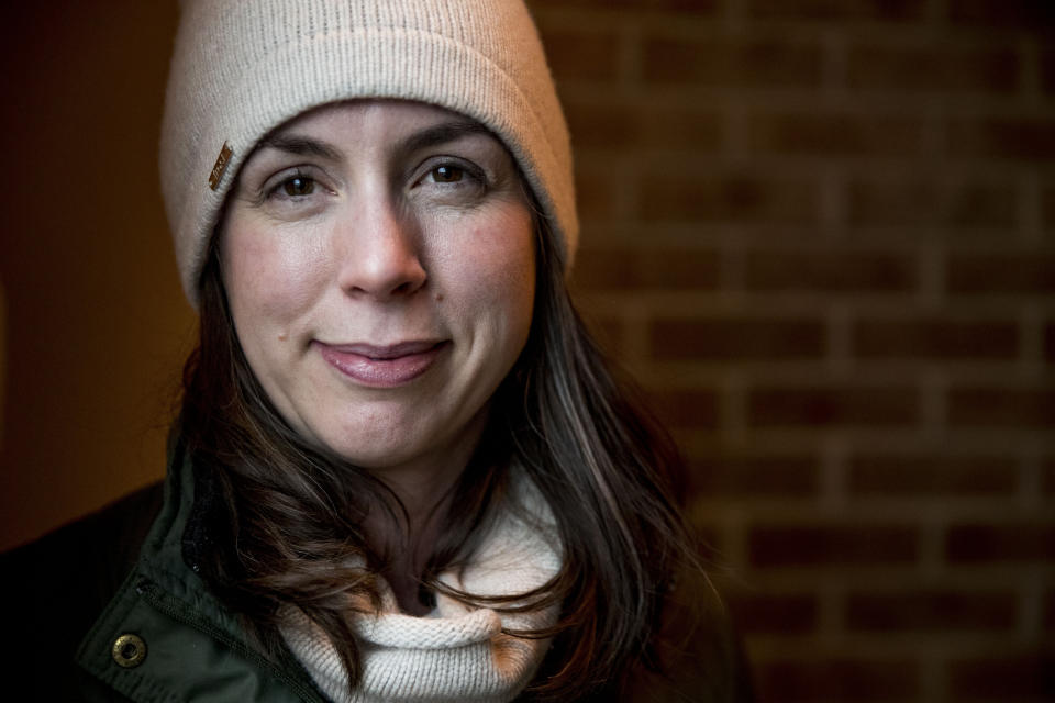 Amanda West, 38, a stay at home mother, poses for a photograph following an interview with the Associated Press, Wednesday, Jan. 15, 2020, in Iowa City, Iowa. (AP Photo/Andrew Harnik)