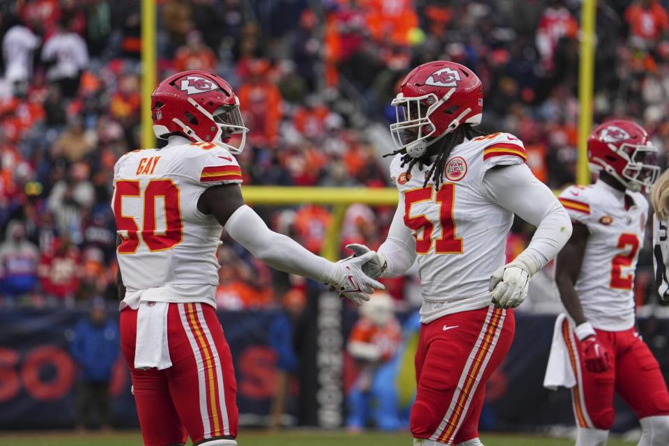 Kansas City Chiefs linebacker Willie Gay and Kansas City Chiefs defensive end Mike Danna celebrate.