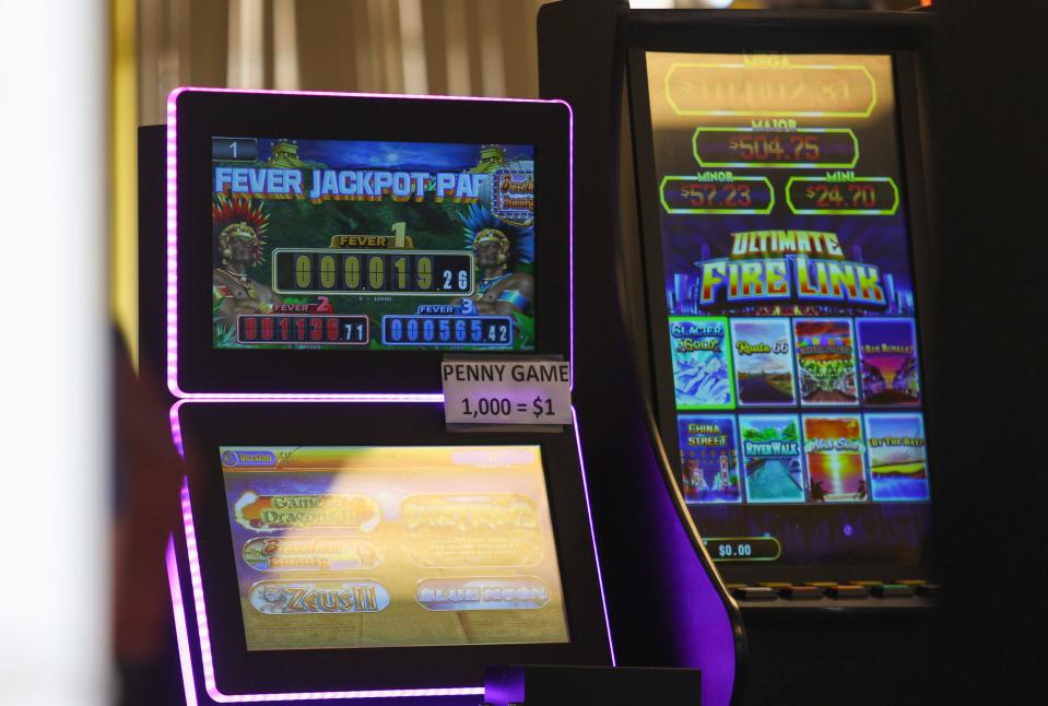 Movers with Lauren Florida Trucks of Palm Bay remove slot machines from inside Midway Arcade, an adult arcade at 4986 South 25th St., on Tuesday, May 9, 2023, in Fort Pierce, during a statewide raid of such arcades that agents discovered operated illegal slot machines. The Florida Gaming Control Commission investigates complaints against facilities that are believed to be running an illegal operation. Slot machines became illegal July 1, 2022, except at 15 approved casinos.