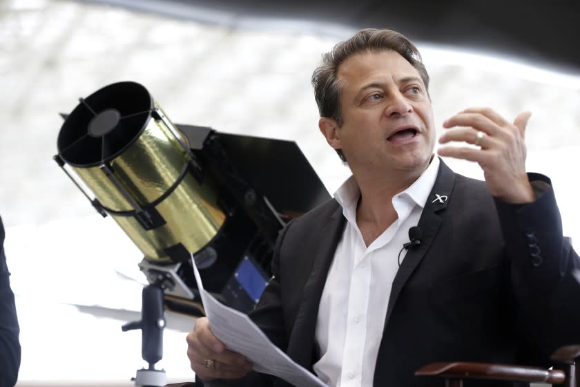 Peter Diamandis, co-chairman of Planetary Resources, an astroid mining company based in Bellevue, Wash., talks to reporters Wednesday, May 29, 2013, in Seattle about his company's plans for the world's first crowd funded space telescope. (AP Photo/Ted S. Warren)