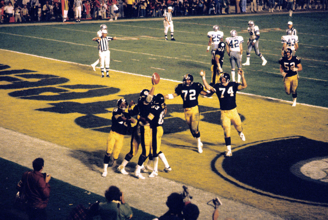 Pittsburgh Steelers Franco Harris celebrates with teammates after a touchdown against the Dallas Cowboys in Super Bowl XIII, on Jan. 21, 1979.<span class="copyright">Tony Tomsic—Sports Illustrated/Getty Images</span>