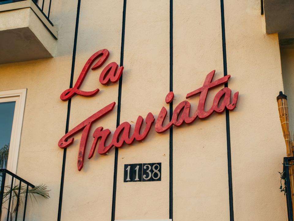 Apartment building sign that reads "La Traviata 1138"