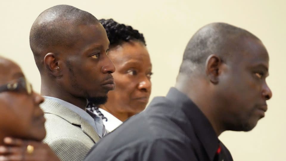 Michael Corey Jenkins, center, and Eddie Terrell Parker, right, listen as one of six former Mississippi law officers pleads guilty to state charges at the Rankin County Circuit Court in Brandon, Mississippi, August 14, 2023. - Rogelio V. Solis/AP