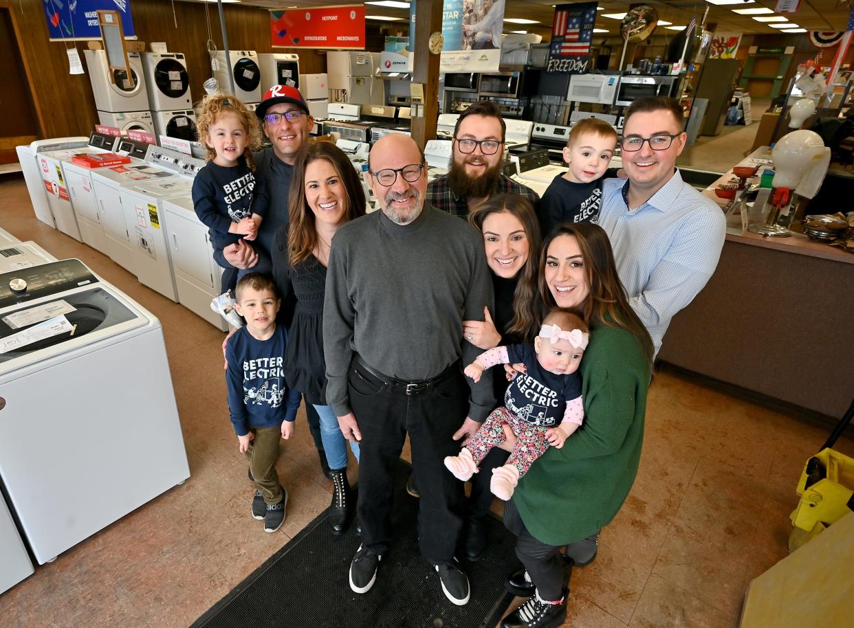 Better Electric at 190 Grafton St. in Worcester is closing after several decades. Owner Raymond Grimaldo Jr., center, stands with his three daughters, Amy Panagiotou, left, Allison Sweeney and Alicia Radzicki. Sons-in-law include Jason Panagiotou, left, Anton Sweeney and Benjamin Radzicki. Grandchildren include Alan, 6, left, Aria Panagiotou, 2, Benjamin Radzicki, 3, right, and Alivia Radzicki, 5 months.