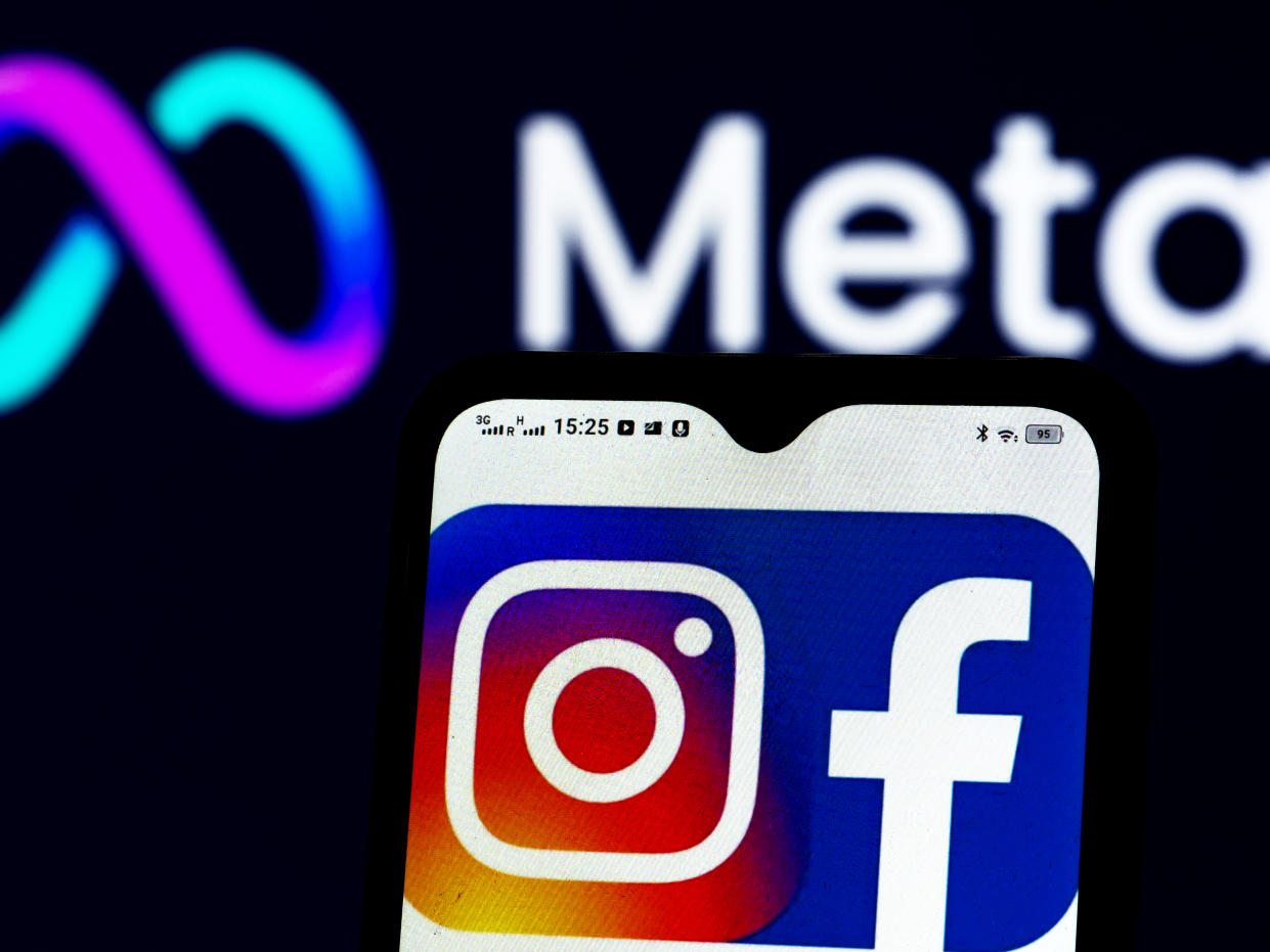 In this photo illustration a Facebook and Instagram logos seen displayed on a smartphone and Meta Platforms logo in the background. (Photo by Igor Golovniov / SOPA Images/Sipa USA)