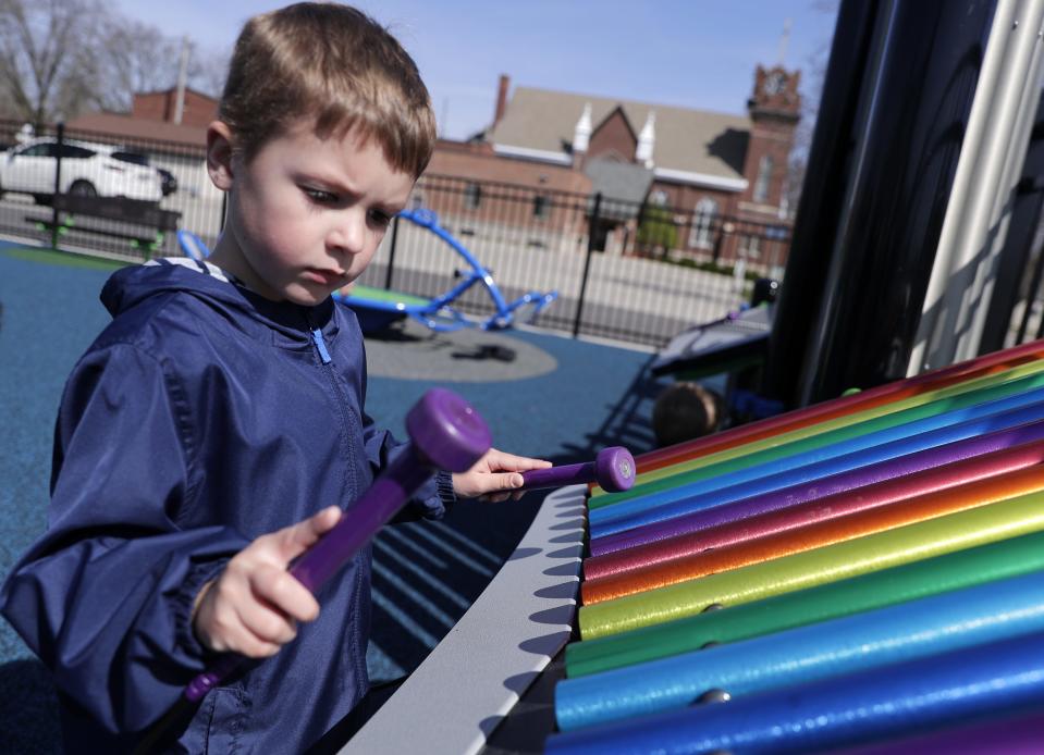 Ethan Schuhmacher plays at Emmanuel Community Inclusive Park, a new inclusive playground, which is open to the public, on the campus of Emmanuel Lutheran Church on April 22 in Seymour.