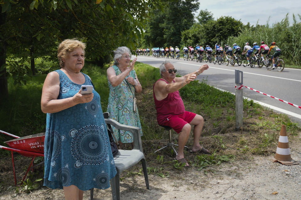 Spectators cheer as the riders pass during the third stage of the Tour de France cycling race over 230.8 kilometers (143.4 miles) with start in Piacenza and finish in Turin, Italy, Monday, July 1, 2024. (AP Photo/Jerome Delay)