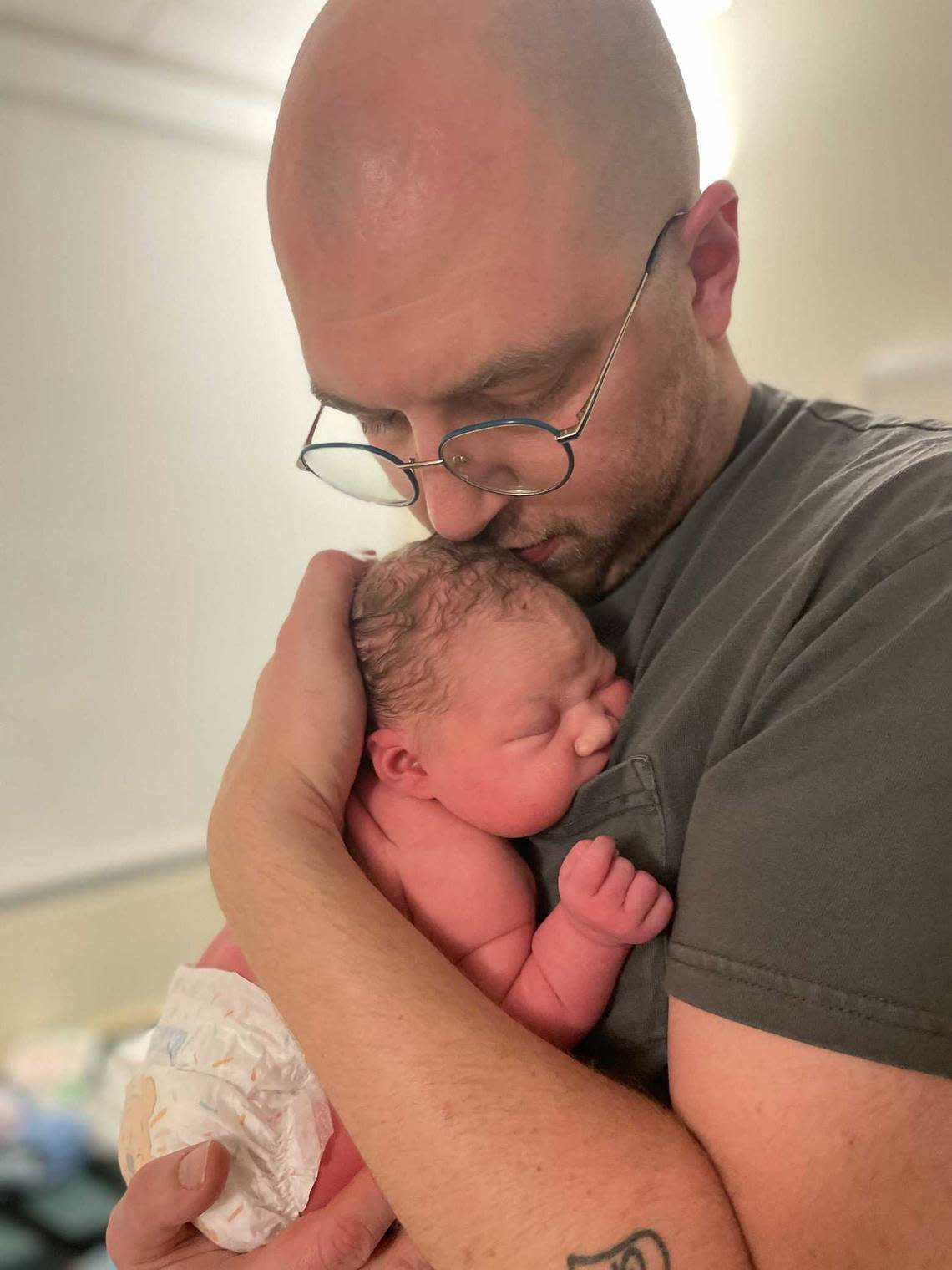 Jack Winks holds his newborn Mabel Winks in this undated photo. Mabel Winks was born on Interstate 80 east on March 2, 2024.