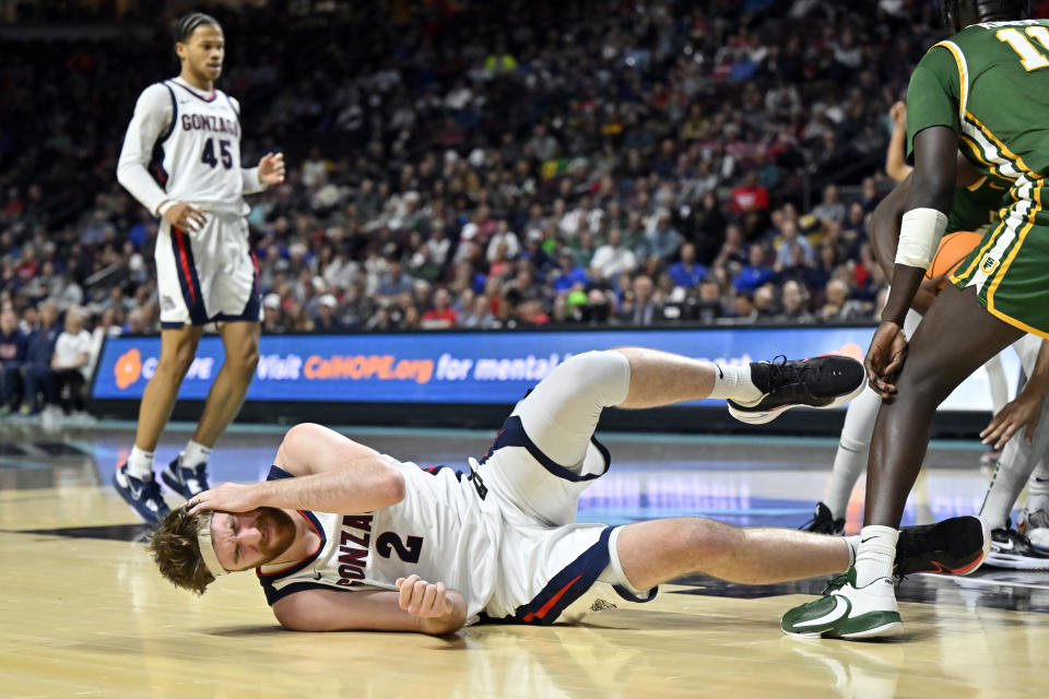 Gonzaga forward Drew Timme (2) falls to the court during the second half of an NCAA college basketball game against San Francisco in the semifinals of the West Coast Conference men's tournament Monday, March 6, 2023, in Las Vegas. (AP Photo/David Becker)