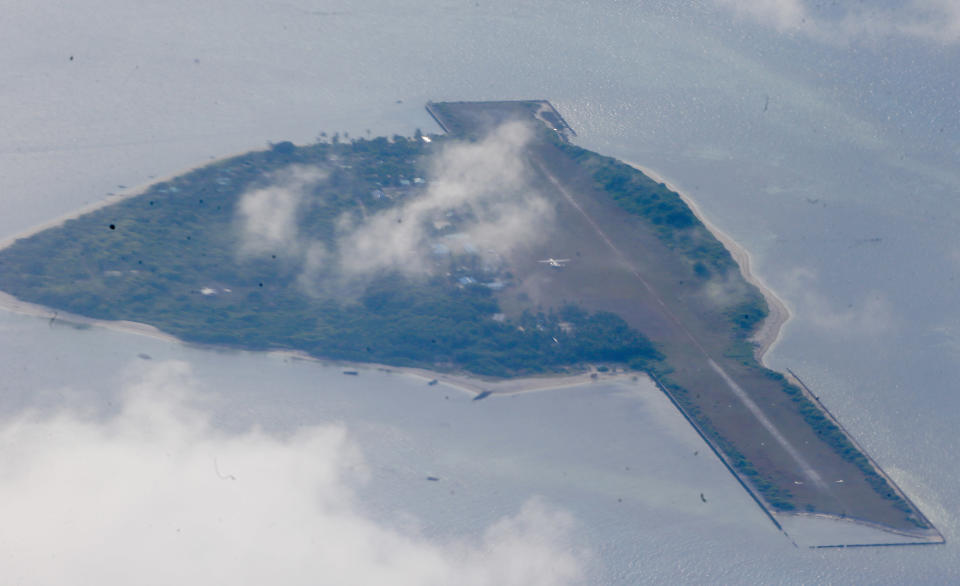 File Photo: The Philippine-claimed Thitu Island on the Spratlys chain of islands is shown off the disputed South China Sea in western Philippines Friday, April 21, 2017. (AP Photo/Bullit Marquez)