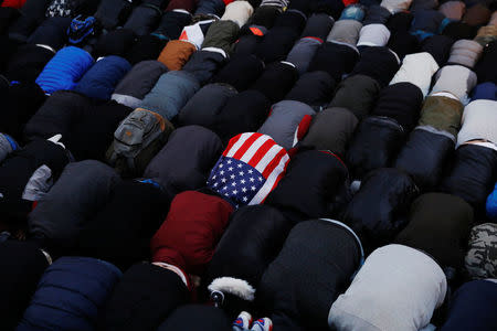 Demonstrators pray as they participate in a protest by the Yemeni community against U.S. President Donald Trump's travel ban in the Brooklyn borough of New York, U.S., February 2, 2017. REUTERS/Lucas Jackson