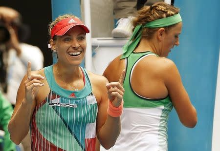 Germany's Angelique Kerber (L) celebrates after shaking hands with Belarus' Victoria Azarenka following Kerber's win in their quarter-final match at the Australian Open tennis tournament at Melbourne Park, Australia, January 27, 2016. REUTERS/Issei Kato