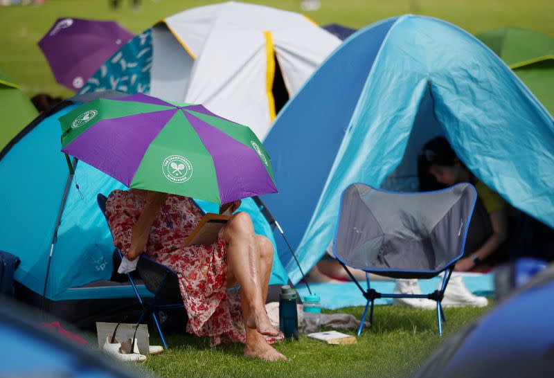 FILE PHOTO: The sight of spectators queueing overnight in tents outside of the Wimbledon grounds will be absent this year as all tickets are being sold online