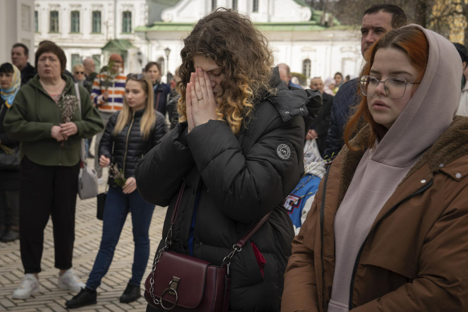 Worshipers gather to celebrate Palm Sunday at Kiev-Pechersk Lavra monastery, Ukraine's most revered Orthodox site in Kyiv, Ukraine, Sunday, April 9, 2023. (AP Photo/Adam Pemble)