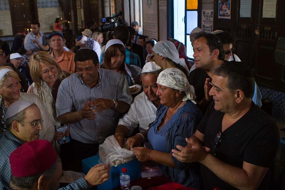 Pilgrims have lunch at El Ghriba Synagogue on the Tunisian island of Djerba, the oldest Jewish monument built in Africa. <a href="https://www.gettyimages.com/detail/news-photo/pilgrims-have-lunch-at-el-ghriba-synagogue-in-tunisian-news-photo/491690053?adppopup=true" rel="nofollow noopener" target="_blank" data-ylk="slk:Amine Landoulsi/Anadolu Agency/Getty Images;elm:context_link;itc:0;sec:content-canvas" class="link ">Amine Landoulsi/Anadolu Agency/Getty Images</a>