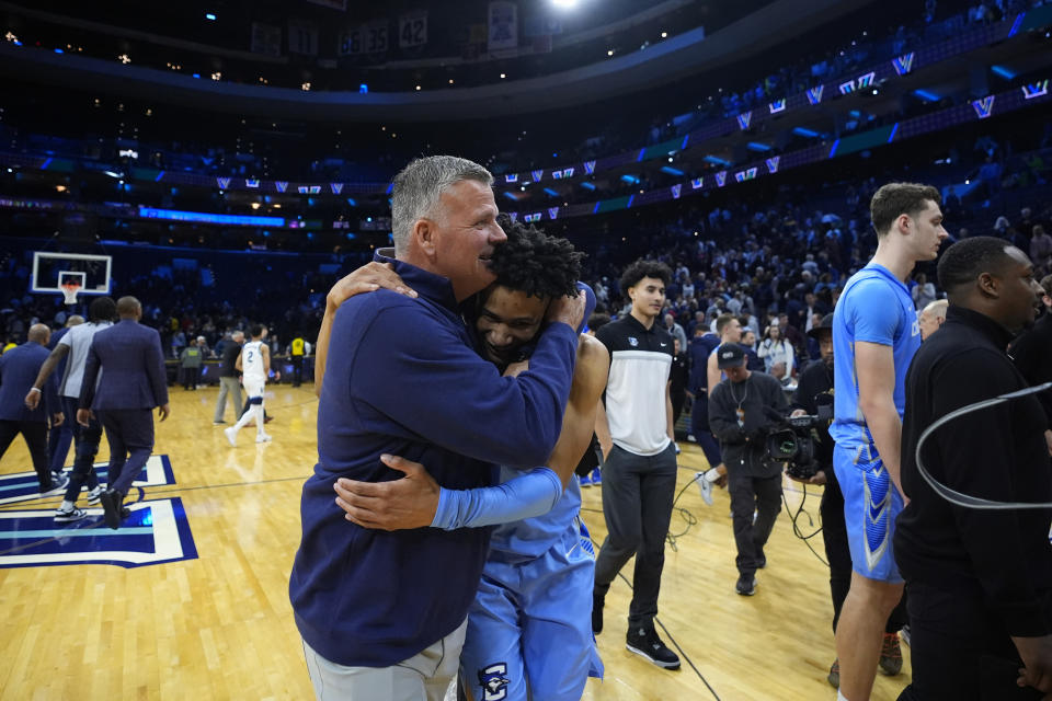 Creighton head coach Greg McDermott, left, and Trey Alexander celebrate after Creighton won an NCAA college basketball game against Villanova, Saturday, March 9, 2024, in Philadelphia. (AP Photo/Matt Slocum)