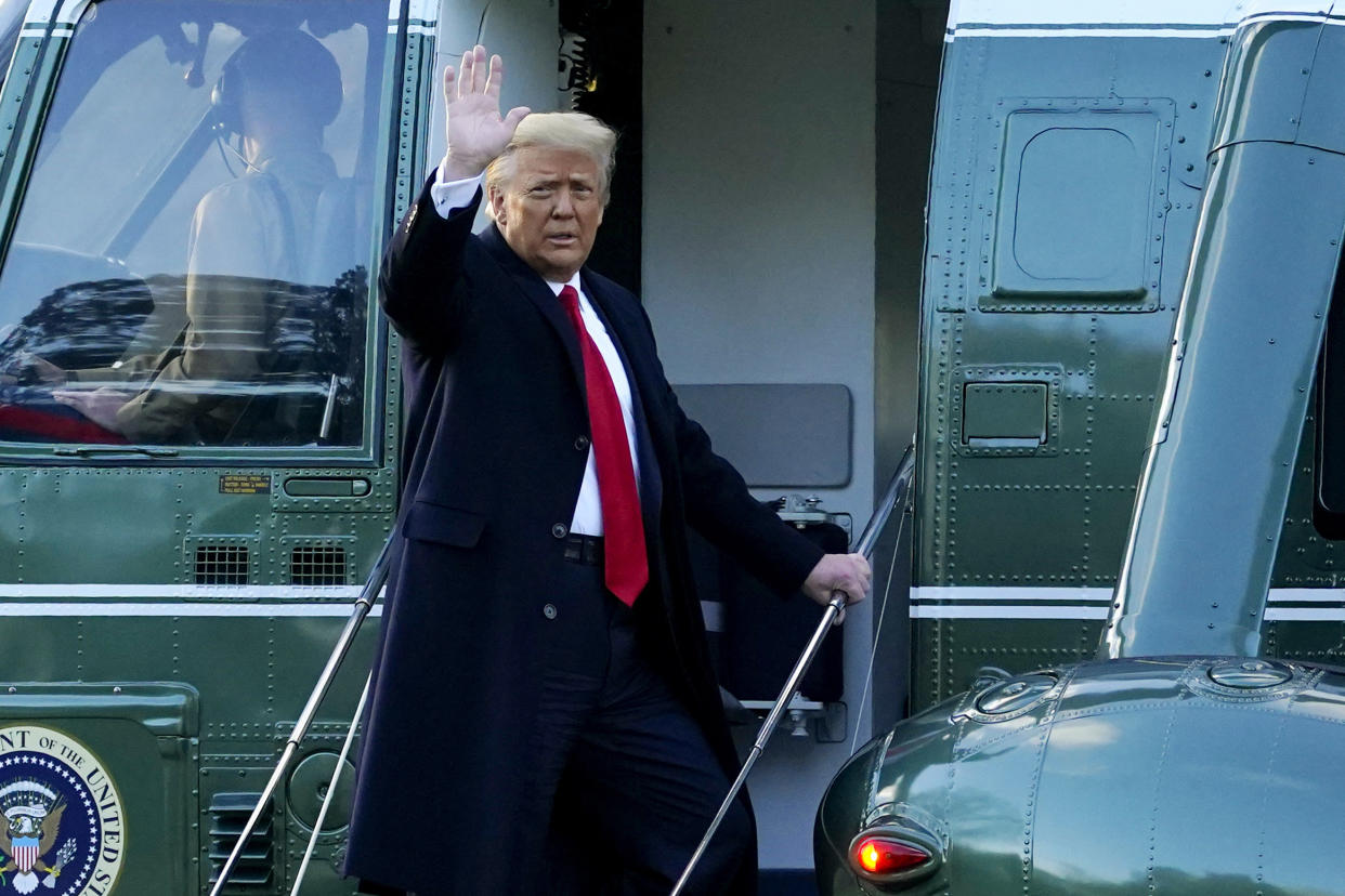 Then-President Donald Trump waves as he boards Marine One on the South Lawn of the White House on Jan. 20. (AP Photo/Alex Brandon)