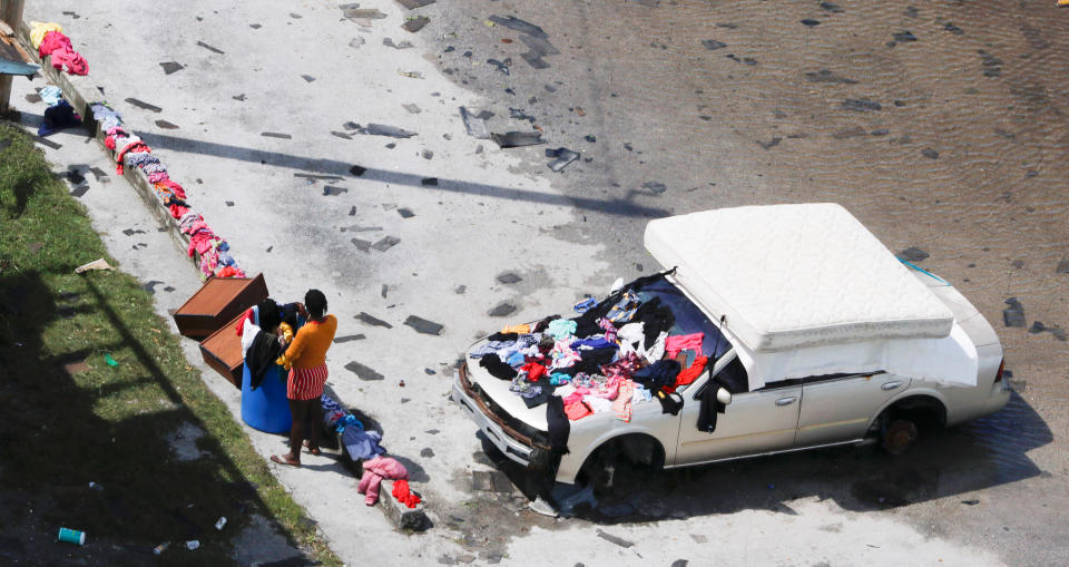 A resident dries clothing and a mattress after hurricane Dorian hit the Grand Bahama Island in the Bahamas,Sept. 4, 2019. (Photo: Joe Skipper/Reuters)