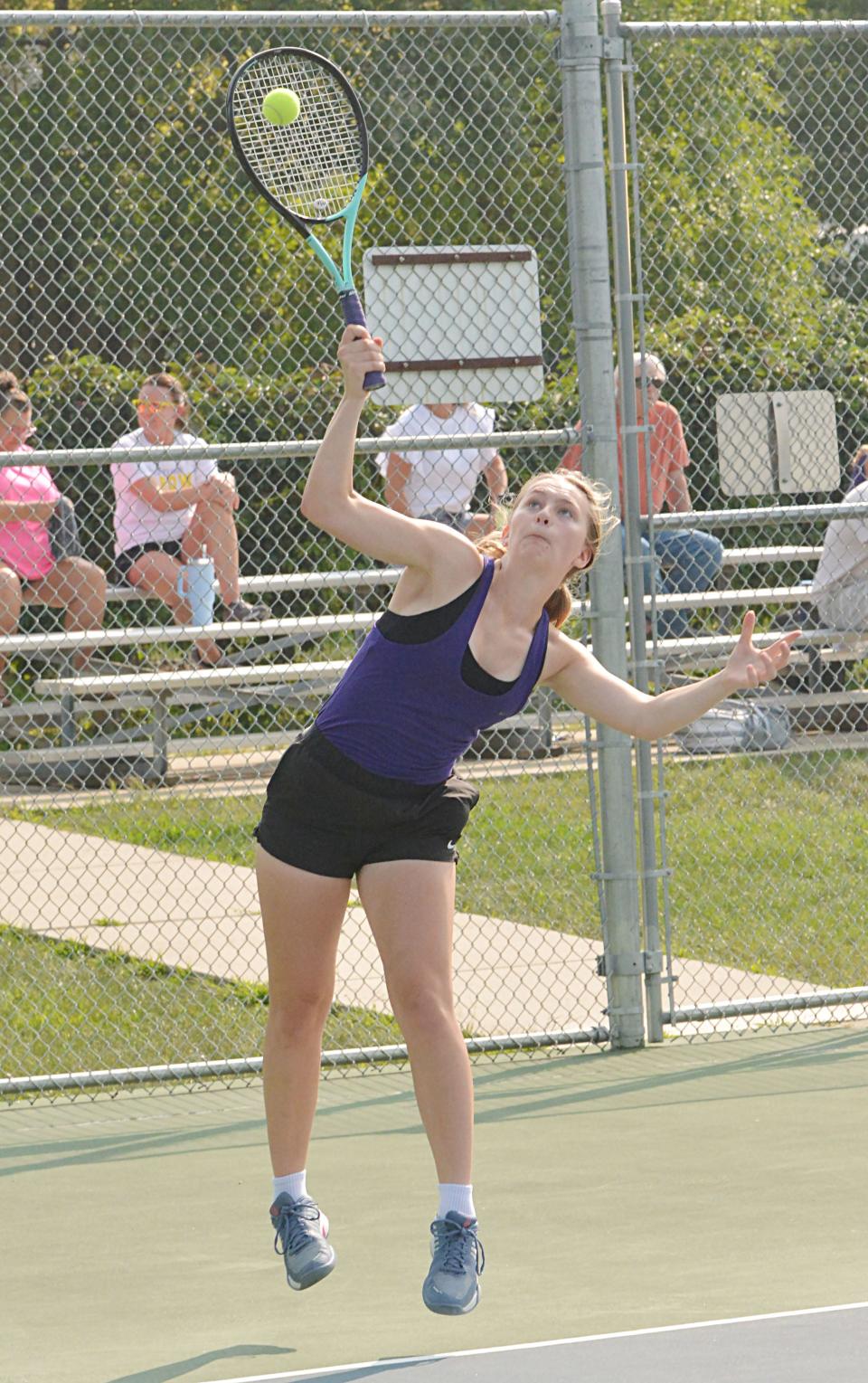 Watertown's Faith Berg hit a serve during a high school girls tennis dual against Sioux Falls Lincoln on Tuesday, Aug. 29, 2023 at the Highland Park courts in Watertown.