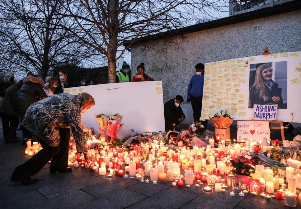 Mourners light candles after a vigil in memory of Aisling Murphy (PA)