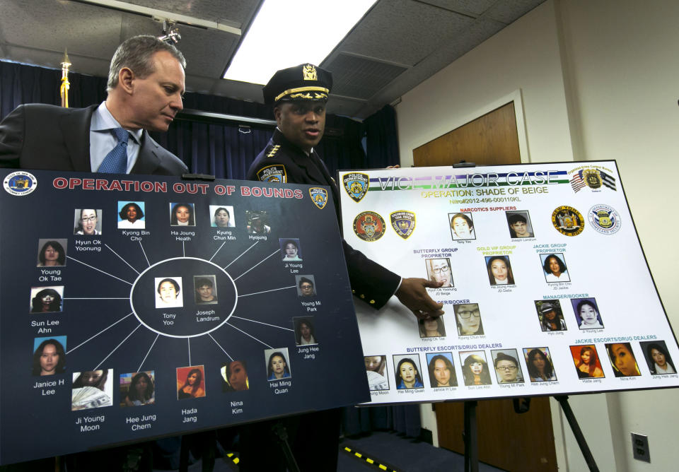 New York Attorney General Eric Schneiderman, left, listens as New York City Police Dept. Chief of Department Philip Banks describes a chart during a news conference, in New York, Thursday, Jan. 30, 2014. Police were rounding up 18 people in New York City on Thursday on allegations they sold "party packs" of cocaine and sex to high-end clients and texted their customers to advertise ahead of this week's Super Bowl festivities. (AP Photo)