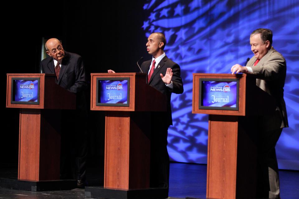 Republican Daniel Harrop, right, squares off against independent Vincent A. "Buddy" Cianci, left, and Democrat Jorge Elorza during a debate in the 2014 race for Providence mayor.