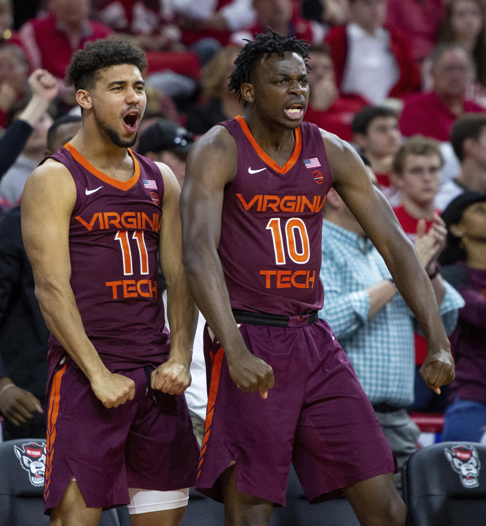 Virginia Tech's Brendan Palmer (11) and Jonathan Kabongo (10) react to a play during the second half of an NCAA college basketball game against North Carolina State in Raleigh, N.C., Saturday, Feb. 2, 2019. (AP Photo/Ben McKeown)