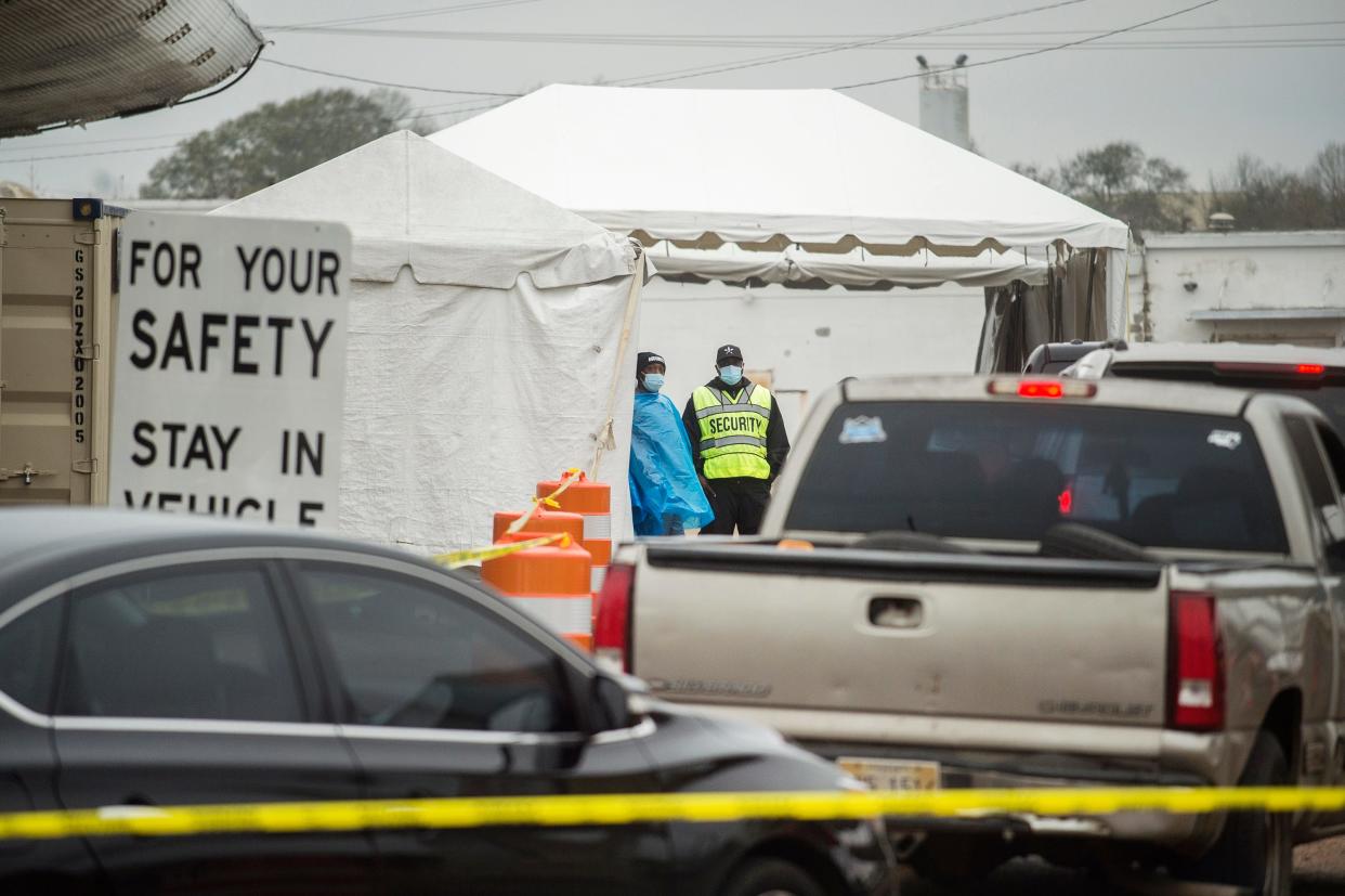 Drivers wait to be tested for COVID-19 at a Hinds-Jackson county health department testing site on Woodrow Wilson Avenue in Jackson, Miss., Thursday, Jan. 6, 2022.