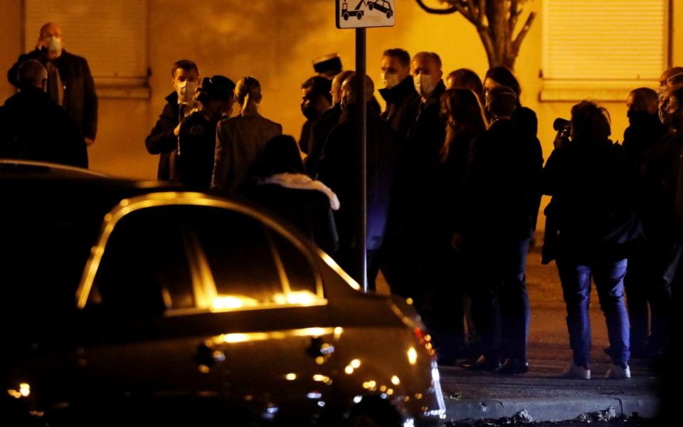 French President Emmanuel Macron arriving at the scene of the stabbing attack - Reuters