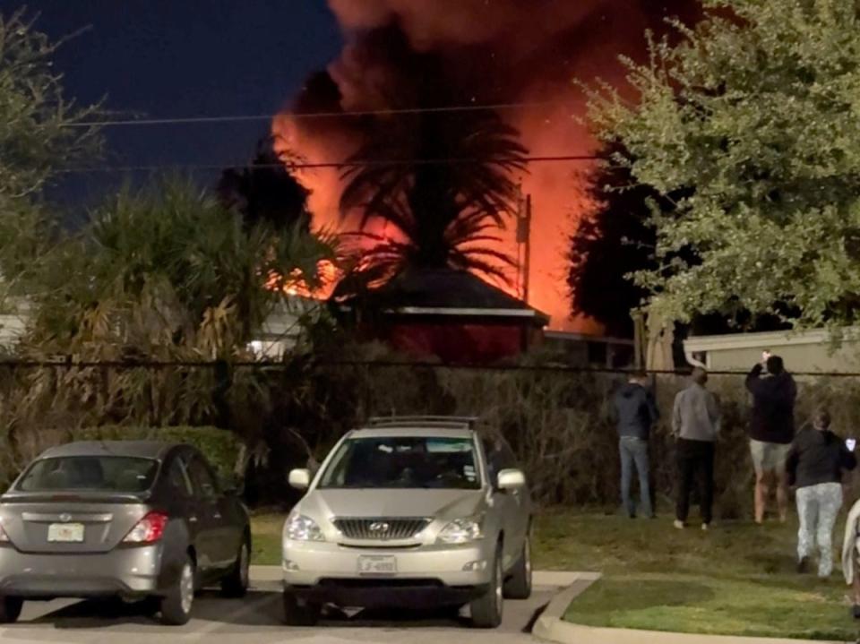 A plume of smoke rises after a small plane crashes in a trailer park in Clearwater, Florida (Steven Ascari via REUTERS)