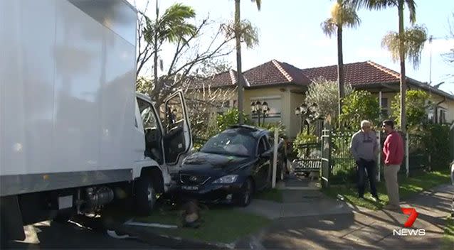 The car was slammed into a front yard. Source: 7 News