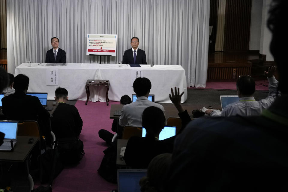 Tomihiro Tanaka, left, President of Family Federation for World Peace and Unification, and its senior member Hideyuki Teshigawara, right, attend a press conference Tuesday, Nov. 7, 2023, in Tokyo. (AP Photo/Shuji Kajiyama)