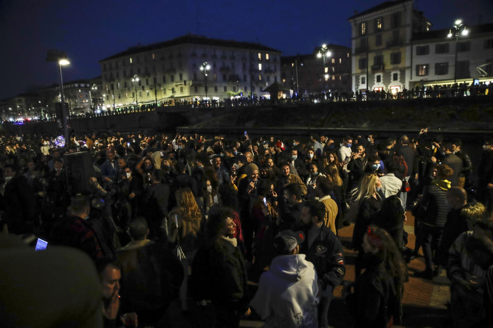 FILE - In this Saturday, Feb. 27, 2021 file photo, people gather at the Darsena dei Navigli, in Milan, Italy. Europe recorded 1 million new COVID-19 cases last week, an increase of 9% from the previous week and ending a six-week decline, WHO said Thursday, March 4, 2021. The so-called UK variant is of greatest concern in the 53 countries monitored by WHO in Europe. (AP Photo/Luca Bruno, File)