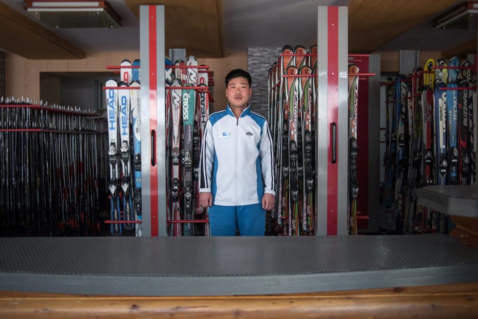 Kim Chol-Nam, 30, poses for a portrait at the ski hire desk where he works at the Masikryong, or Masik Pass, ski resort near Wonsan.