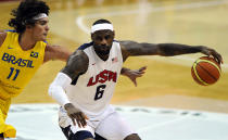 WASHINGTON, DC - JULY 16: LeBron James #6 of the US Men's Senior National Team dribbles past Anderson Franca Varejao #11 of Brazil in the third quarter during a pre-Olympic exhibition basketball game at the Verizon Center on July 16, 2012 in Washington, DC. The US Senior Men's National Team won, 80-69. (Photo by Patrick Smith/Getty Images)