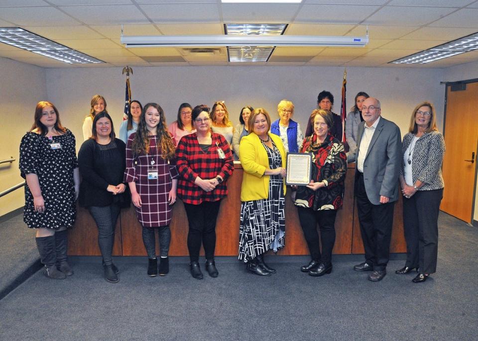 Commissioner Becky Foster, on Nov. 16, presents a proclamation to Jaime Parsons and the staff of the Viola Startzman Clinic in recognition of National Rural Health Day.