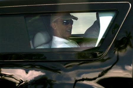 U.S. President Barack Obama departs his vacation home in Kailua, Hawaii December 21, 2013. REUTERS/Kevin Lamarque