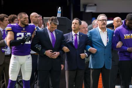 Sep 24, 2017; Minneapolis, MN, USA; Minnesota Vikings defensive back Harrison Smith (22) locks arms with general manager Rick Spielman (left) and owner Mark Wilf (middle) and owner Ziggy Wilf (right) before the game against the Tampa Bay Buccaneers at U.S. Bank Stadium. Mandatory Credit: Brad Rempel-USA TODAY Sports