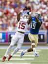 Oklahoma defensive back Kendel Dolby (15) intercepts a ball intended for Tulsa wide receiver Devan Williams (19) during the first half of an NCAA college football game Saturday, Sept. 16, 2023, in Tulsa, Okla. (AP Photo/Alonzo Adams)