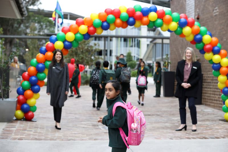 Children return to campus for the first day of New South Wales public schools fully re-opening in Sydney