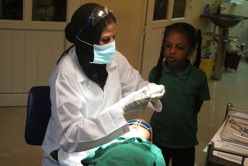 <span class="caption">A child about to have his rotten tooth capped at the author's clinic in Khartoum, Sudan. </span> <span class="attribution"><span class="license">Author provided</span></span>