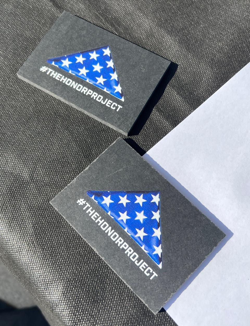 These #Honor Project commemorative tokens were placed on the graves at 14 national cemeteries, including Jacksonville.