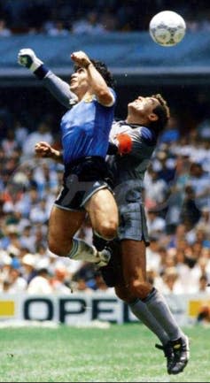 Diego Maradon and Peter Shilton in mid air.