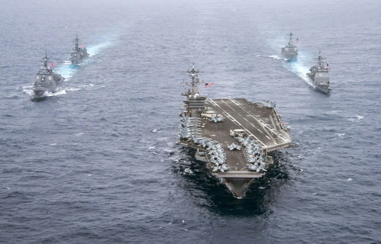 Aircraft carrier USS Carl Vinson leads the US Navy and the Japan Maritime cruisers and destroyers, on April 26, 2017